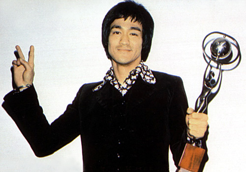 bruce lee with an award